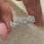 Halo wedding band with sparkling diamond accents.
