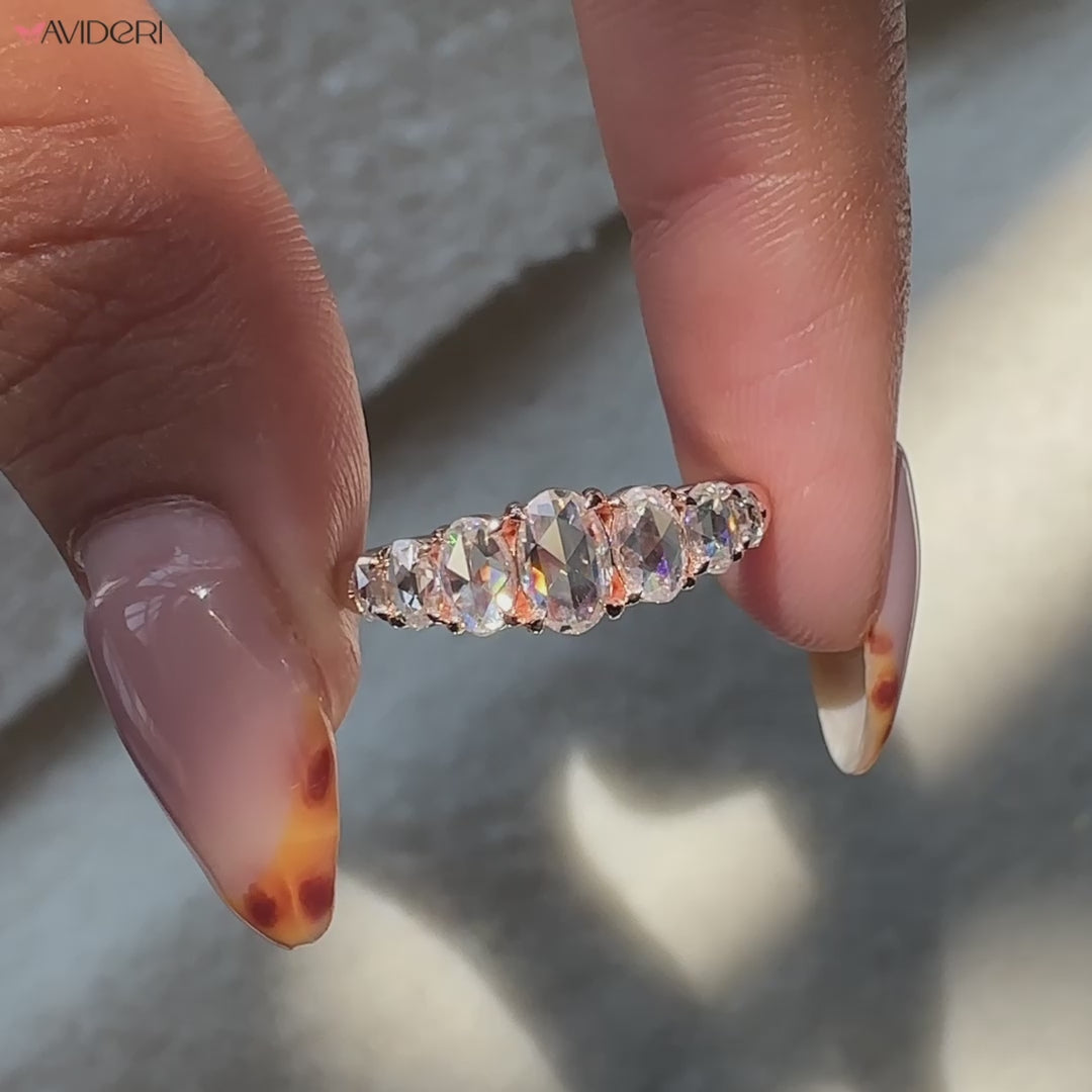 Rose cut wedding band featuring an oval stone and claw prong setting.