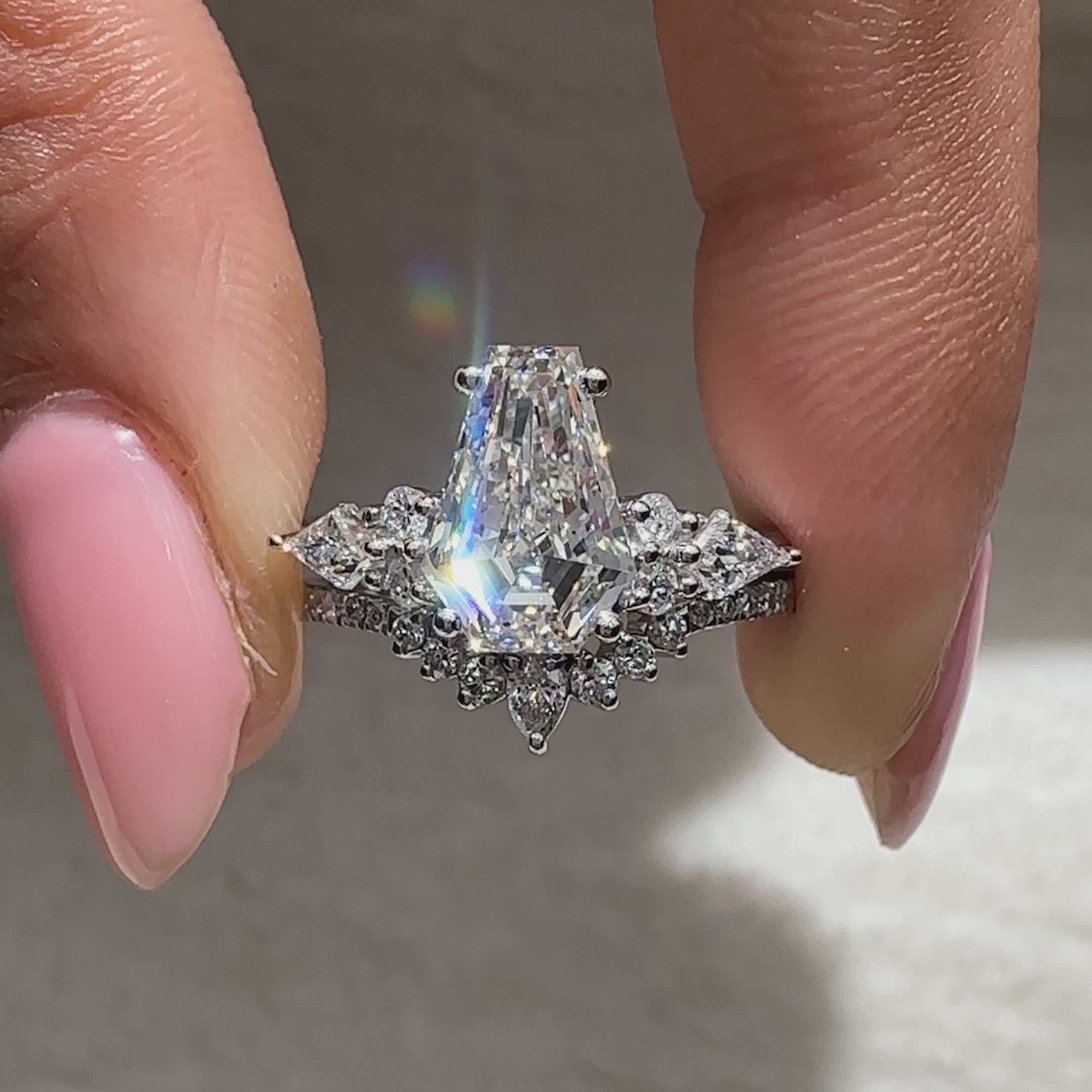 Coffin diamond ring with matching pear diamond curved band
