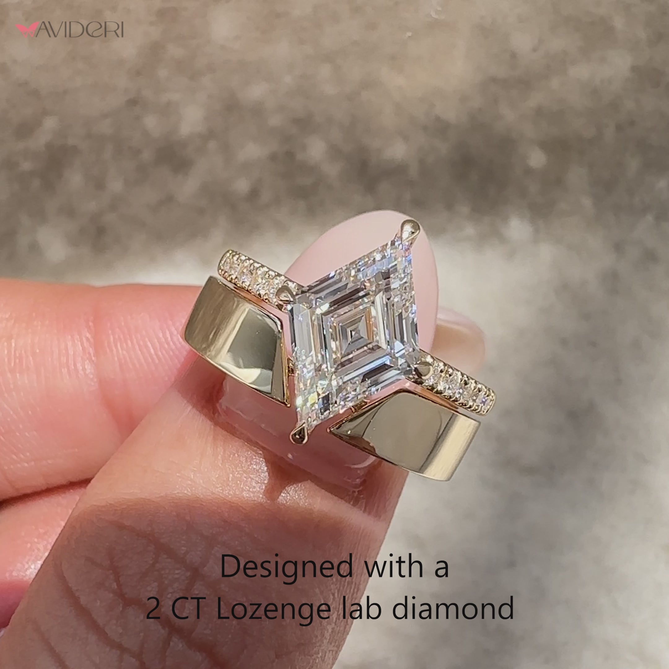 Lozenge diamond ring with four claw prongs.
