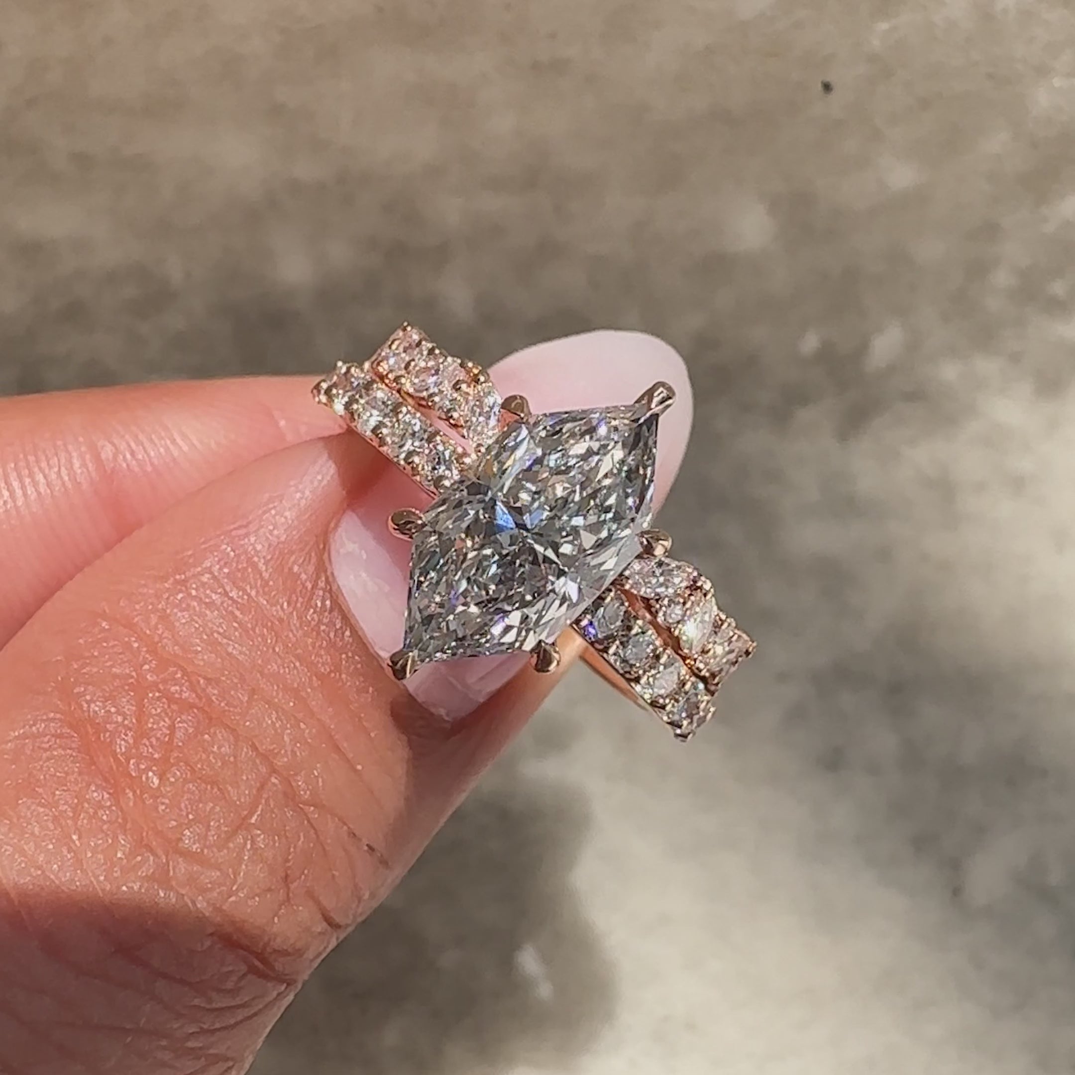 Marquise ring with round diamond band design.
