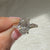 Lab grown oval diamond ring with cathedral and halo setting
