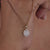 Sunburst halo oval shape wedding pendant for a stunning look.