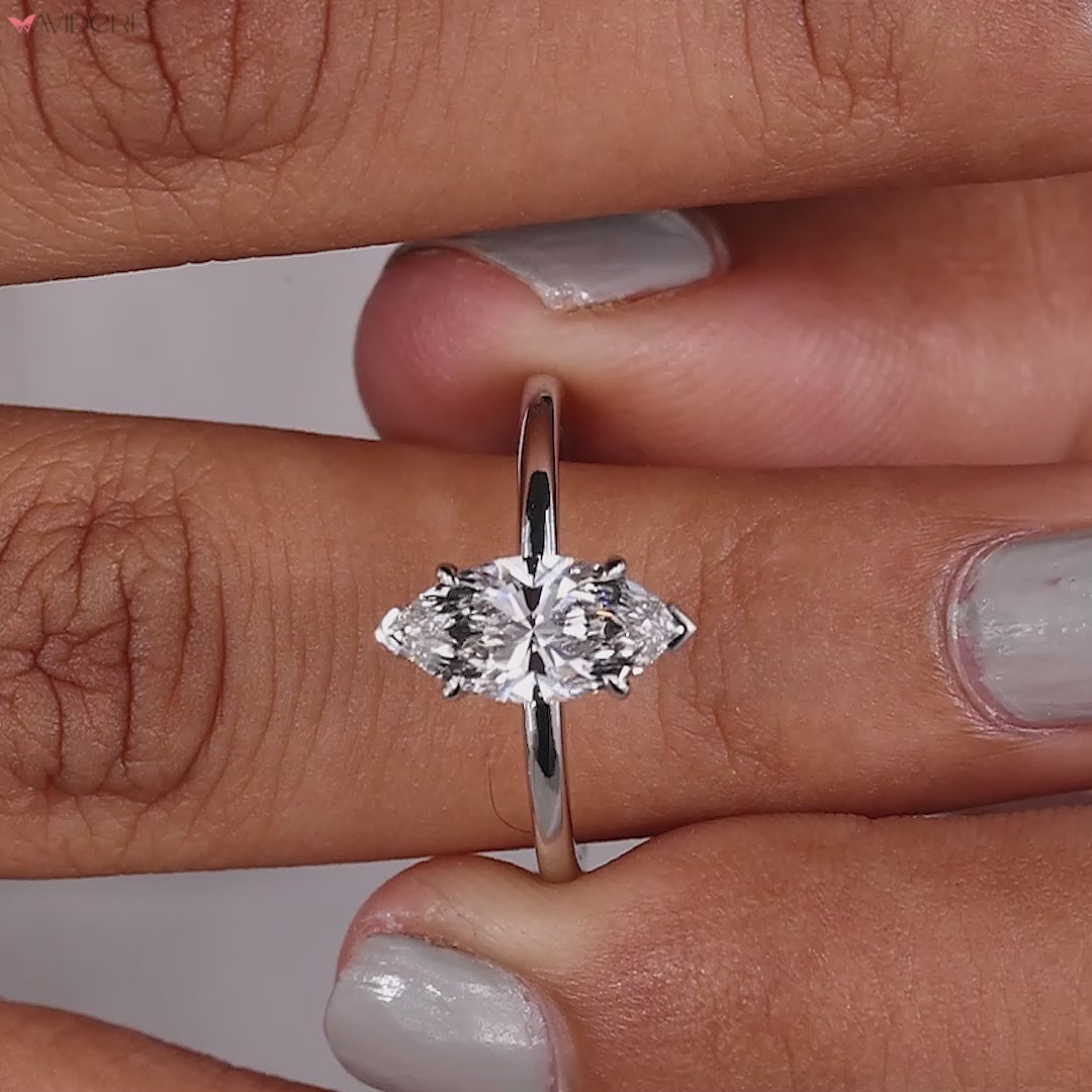 Handmade marquise solitaire ring crafted with precision, featuring an igi certified Lab Grown Diamond in a v prong.
