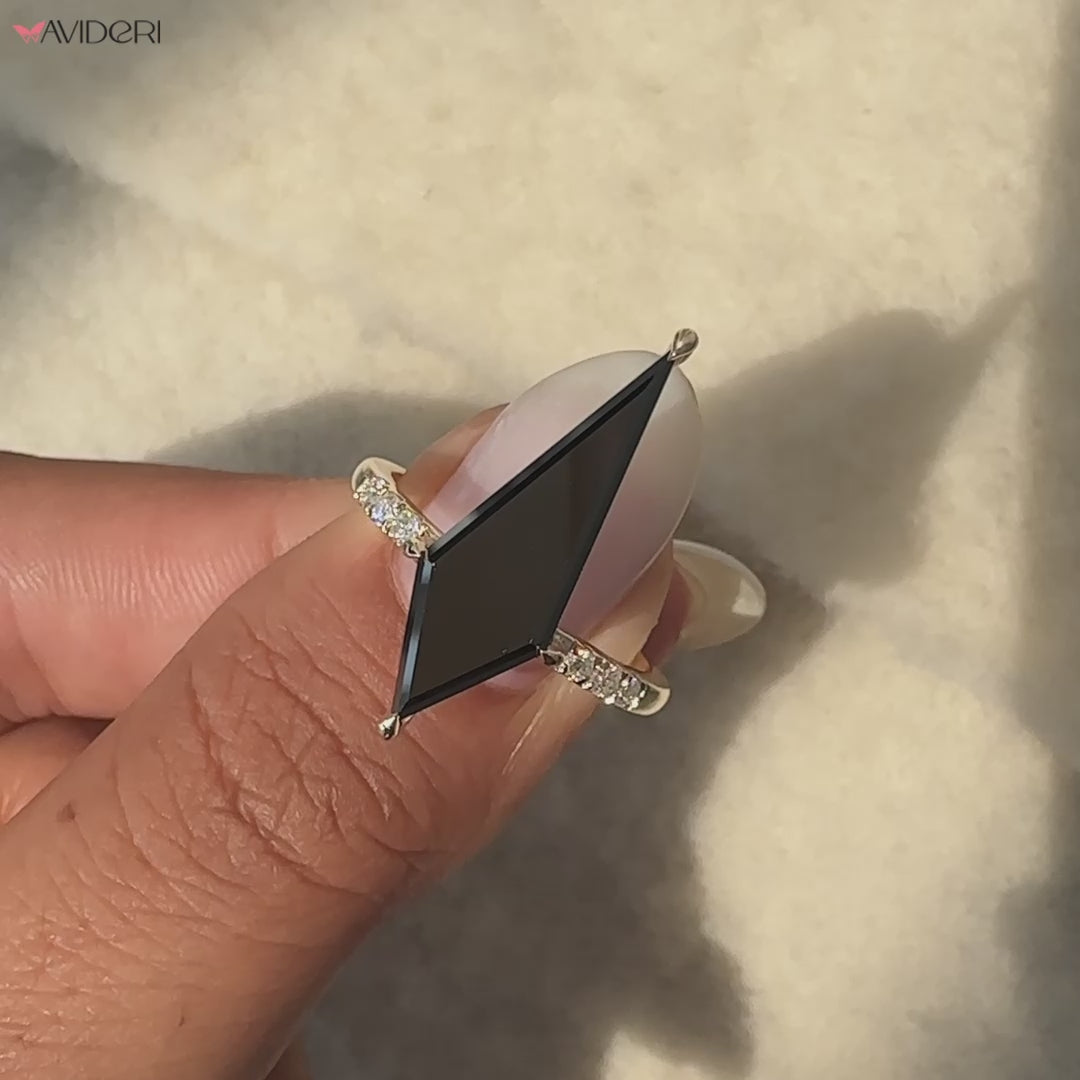 Kite cut moissanite ring with sparkling side stones and a unique shape.
