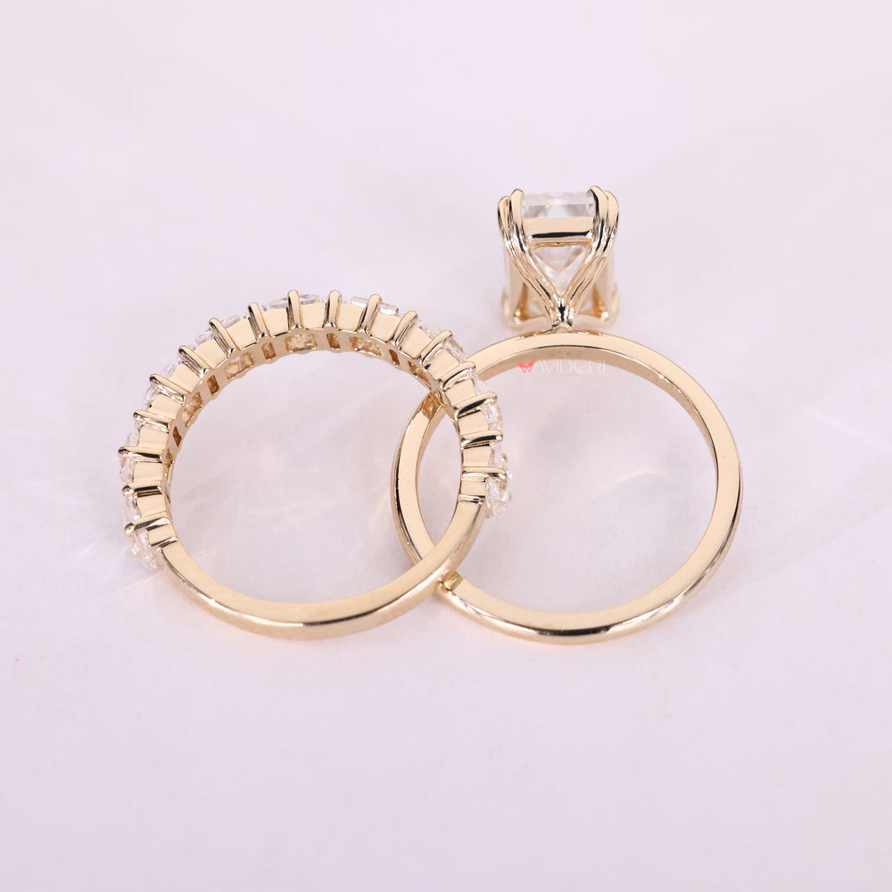 Emerald cut engagement ring styled with a bold look and yellow gold finish.