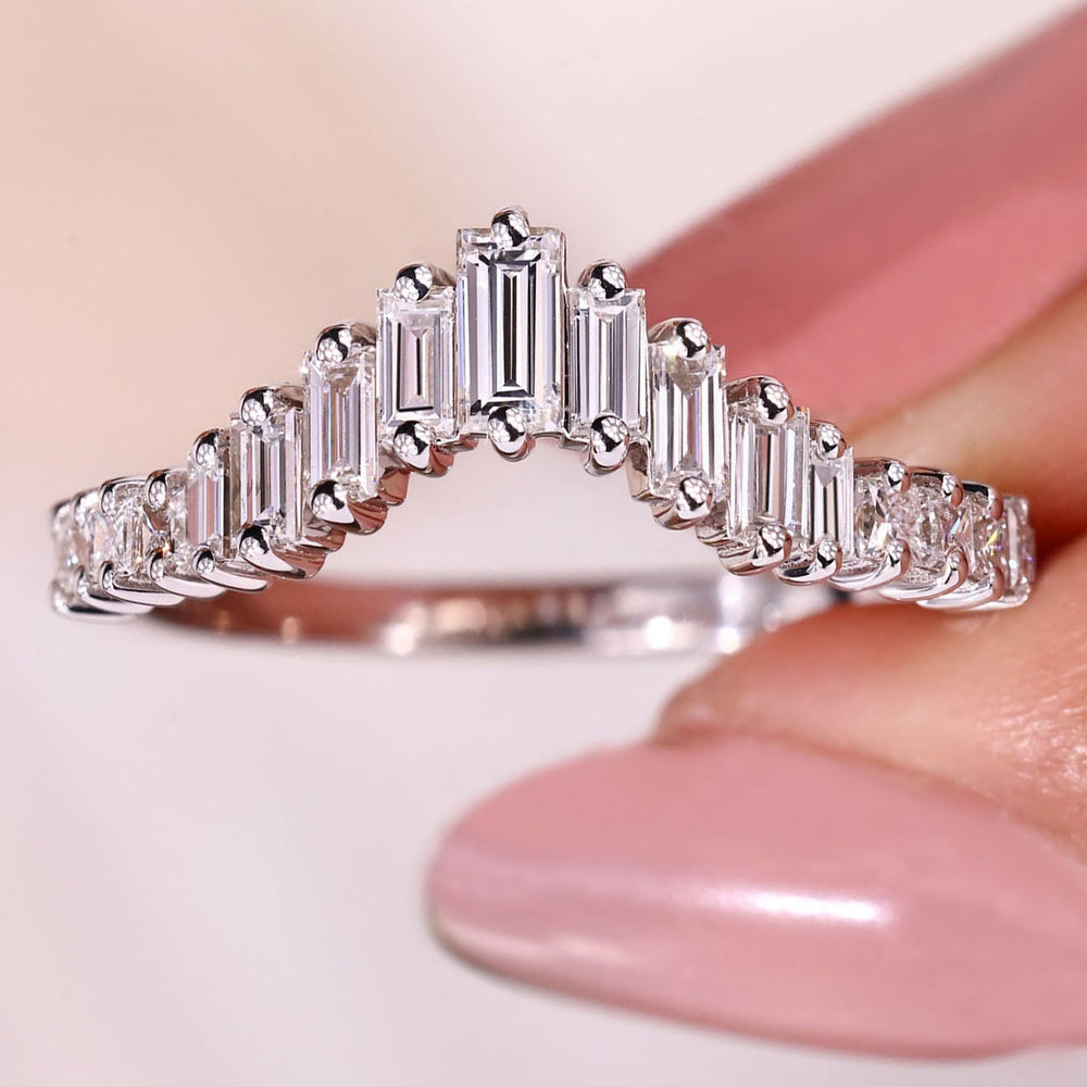Half eternity wedding band with clean prong setting.
