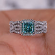 Cyan Blue Princess Cut Moissanite shines brightly in the engagement ring.