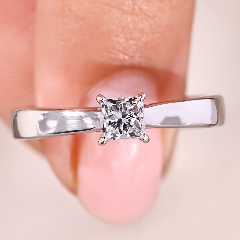 Princess cut solitaire ring with white gold diamond ring.