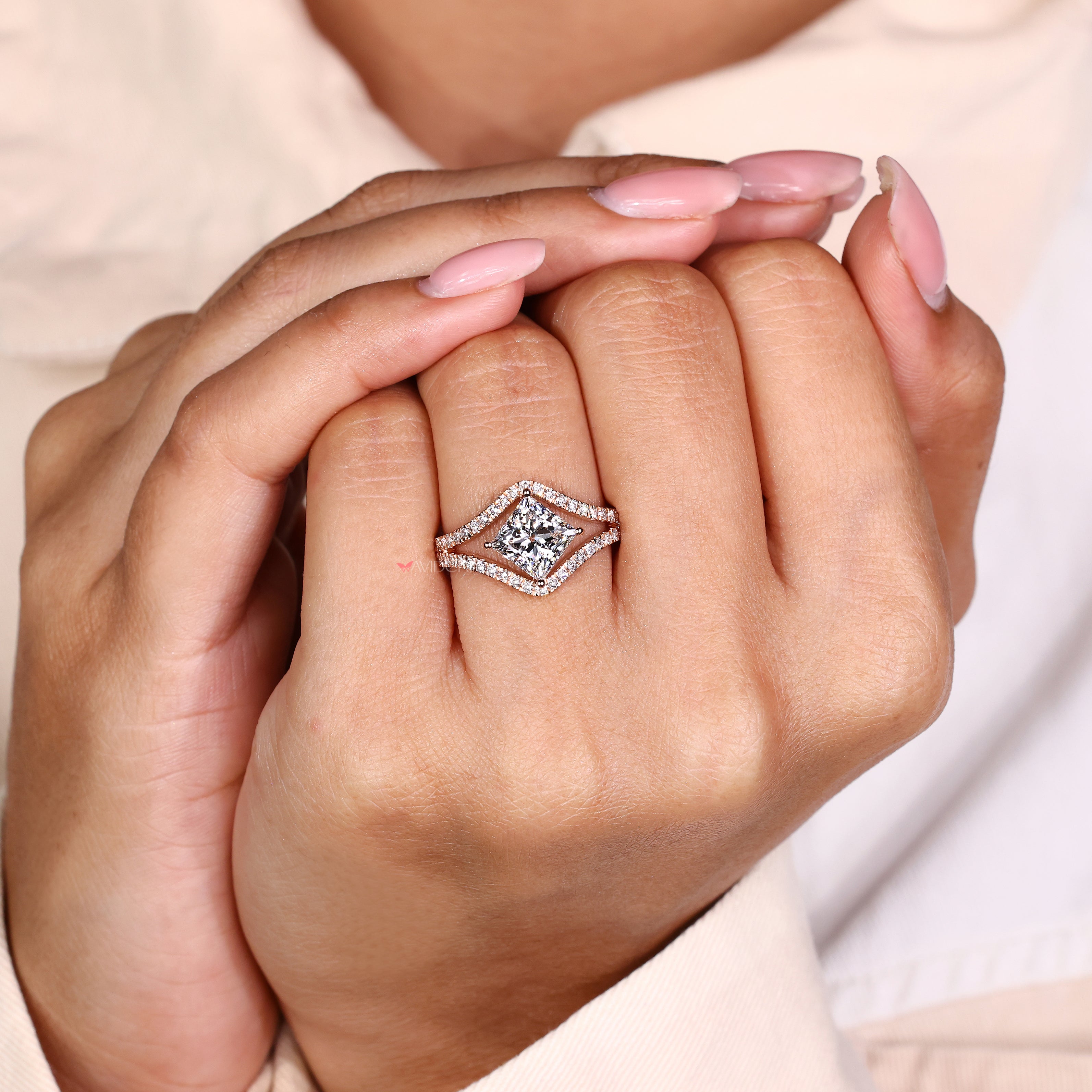 Split shank princess diamond ring with basket style setting
