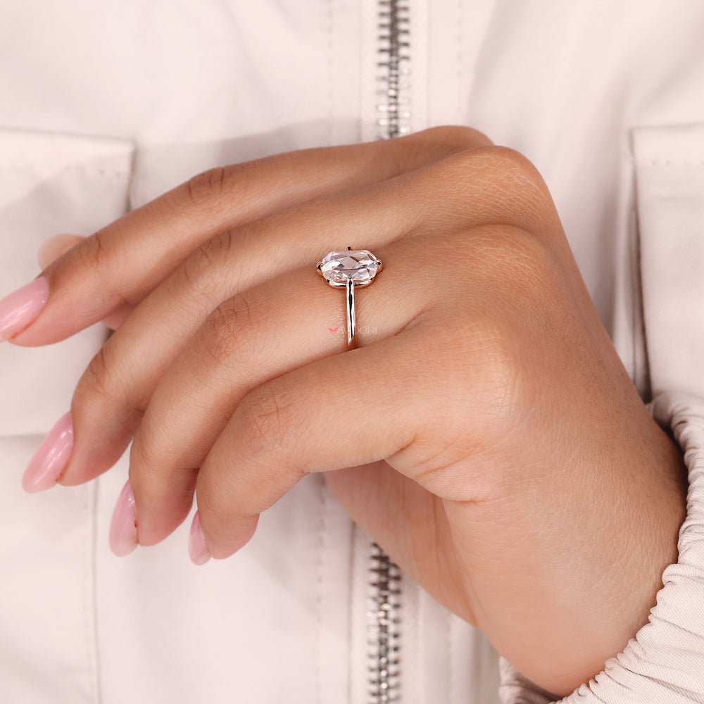 Compass prong setting ring featuring cushion rose cut moissanite for a secure fit.
