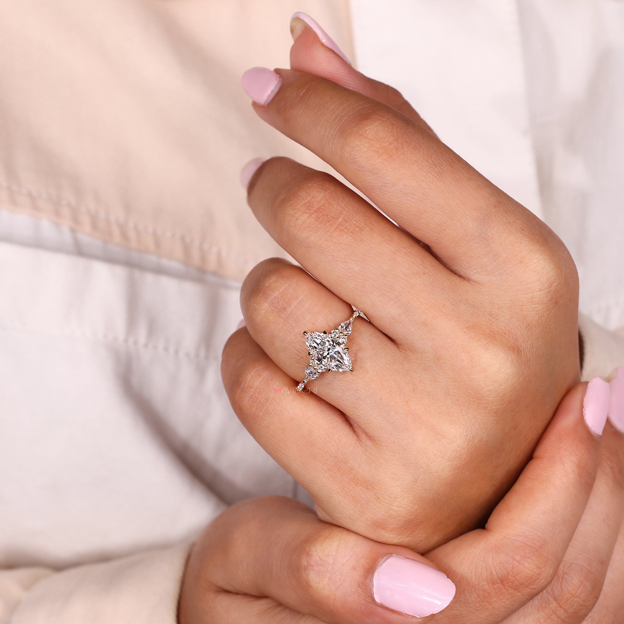 Muse setting ring with marquise center diamond.