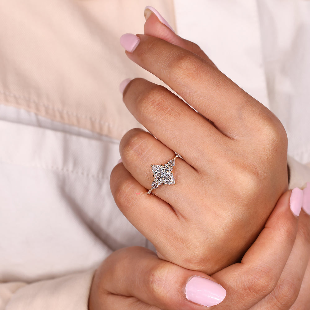 Muse setting ring with marquise center diamond.