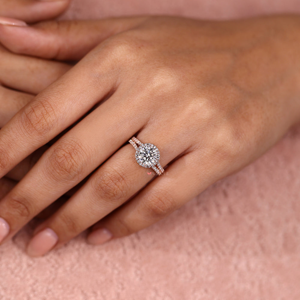Round halo diamond ring with split pave style band.
