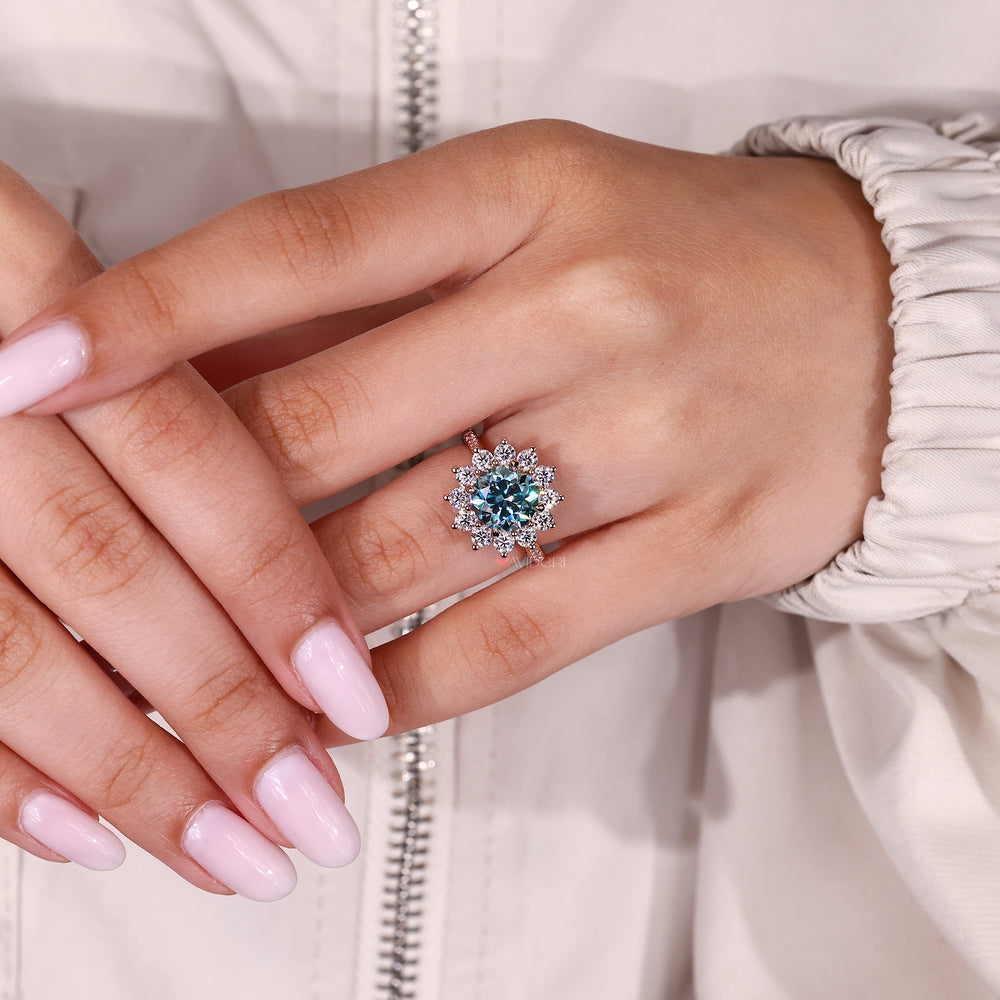 Round cut moissanite ring prong and pave design.
