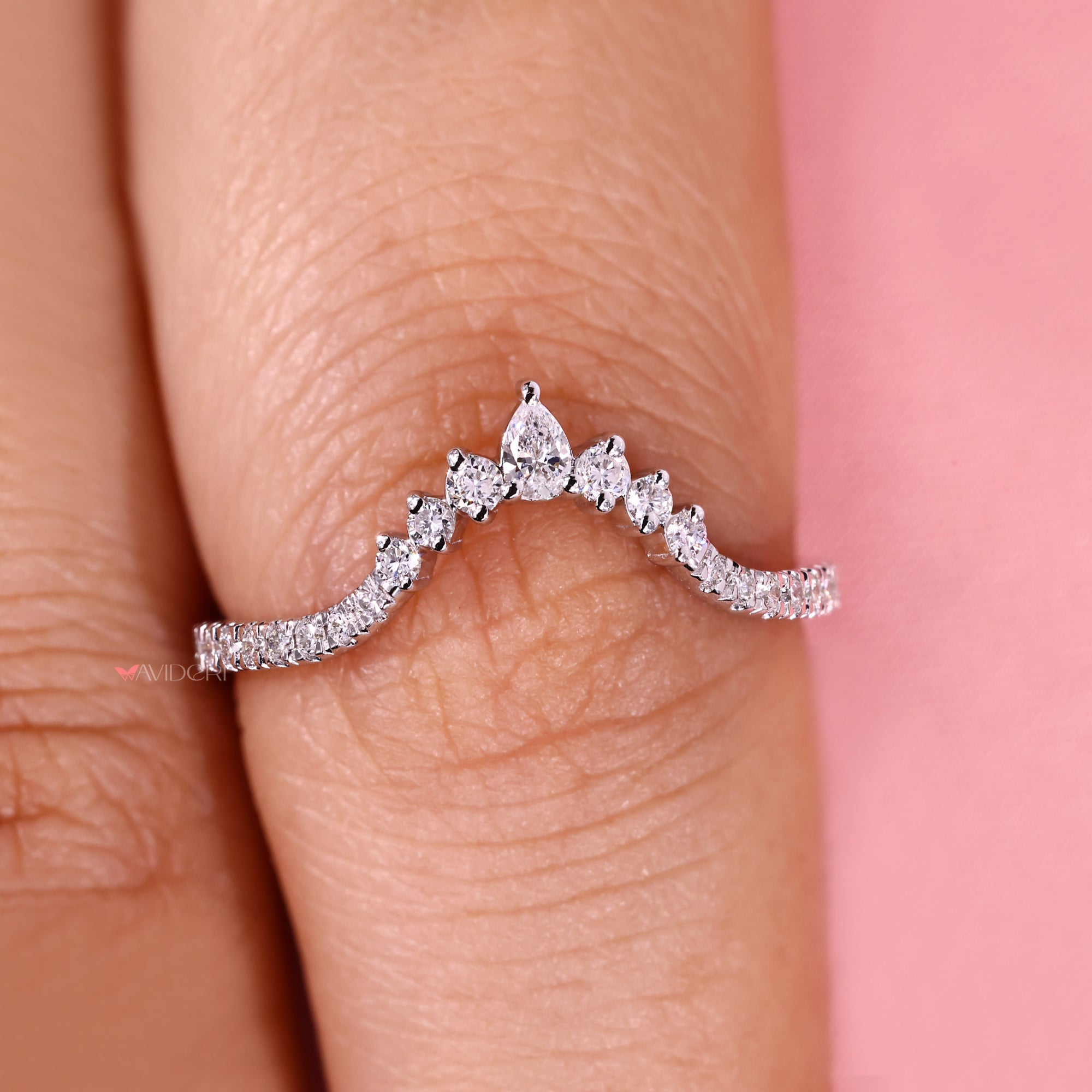 Lab grown pear and round diamond chevron band.
