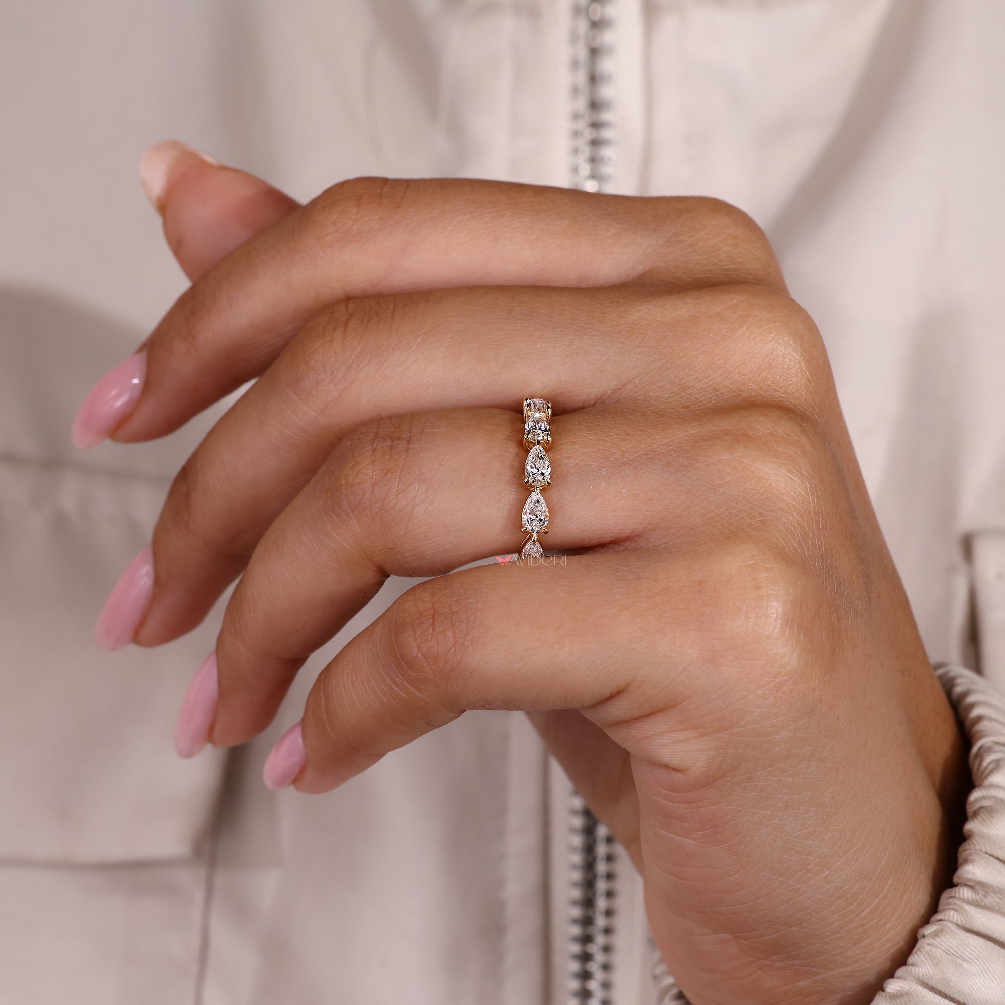Handmade full eternity band with pear cut diamonds.
