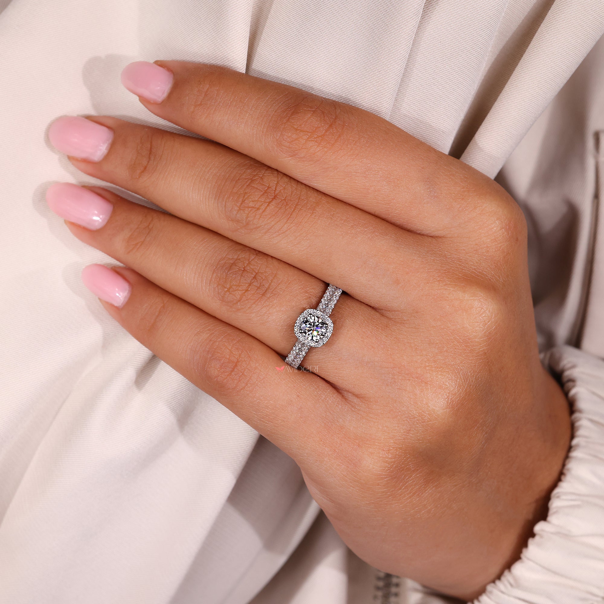 Handmade jewelry with pave and halo accents.