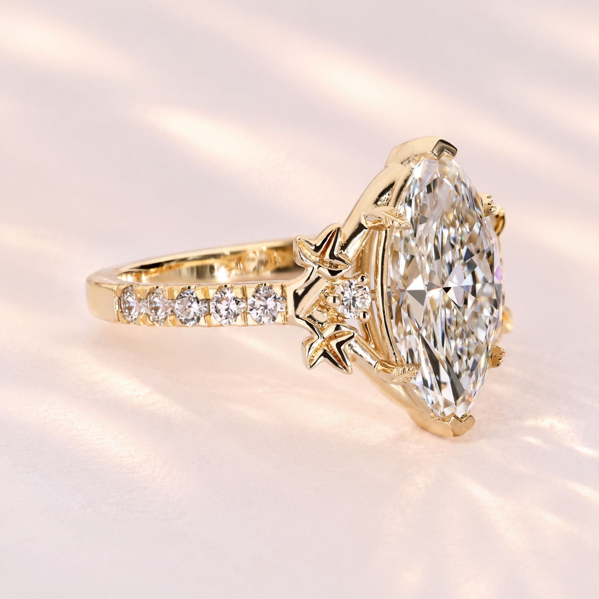 Nature inspired marquise ring with leaf prongs.
