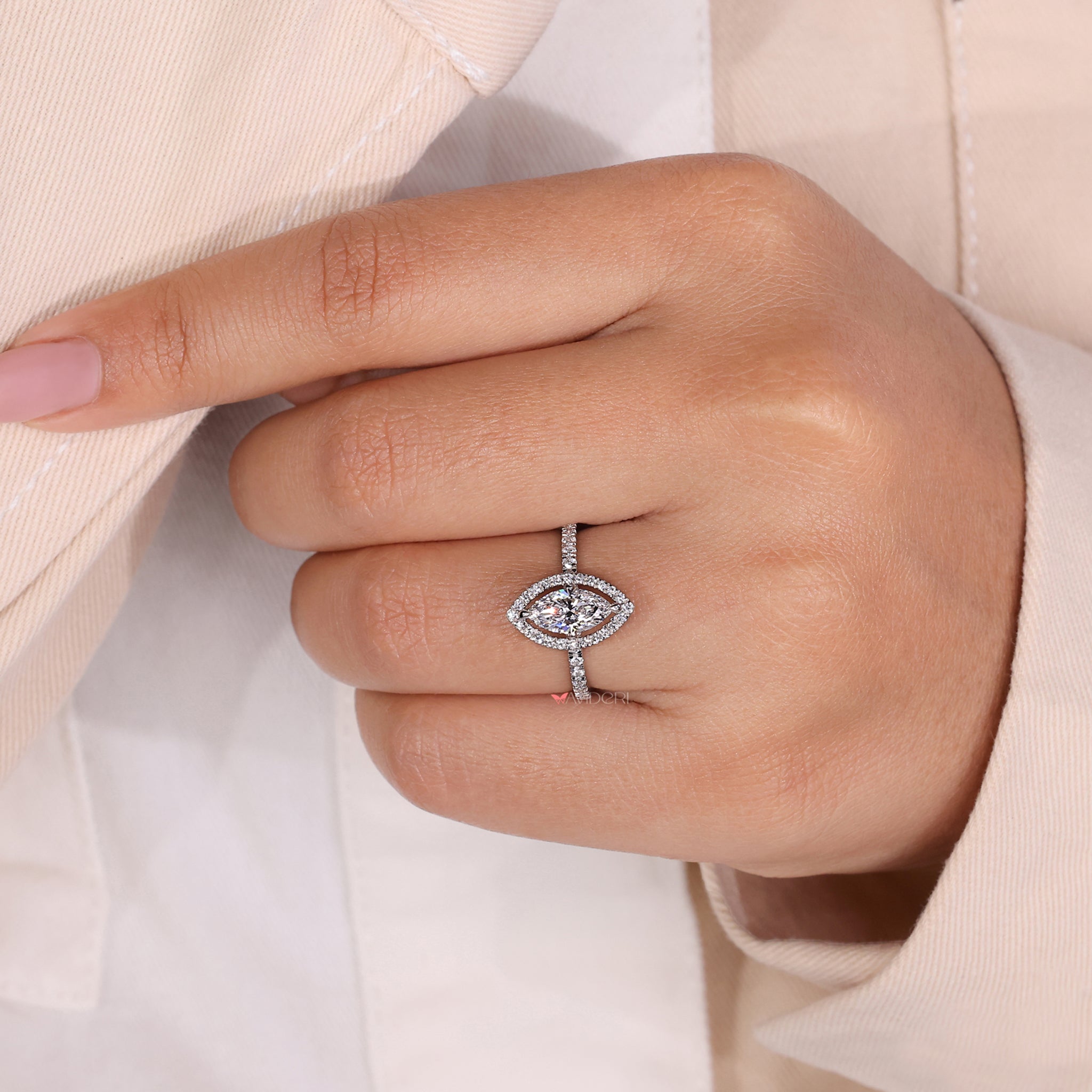 Avideri engagement ring featuring a marquise halo design and pave stones, perfect for modern and classic tastes.
