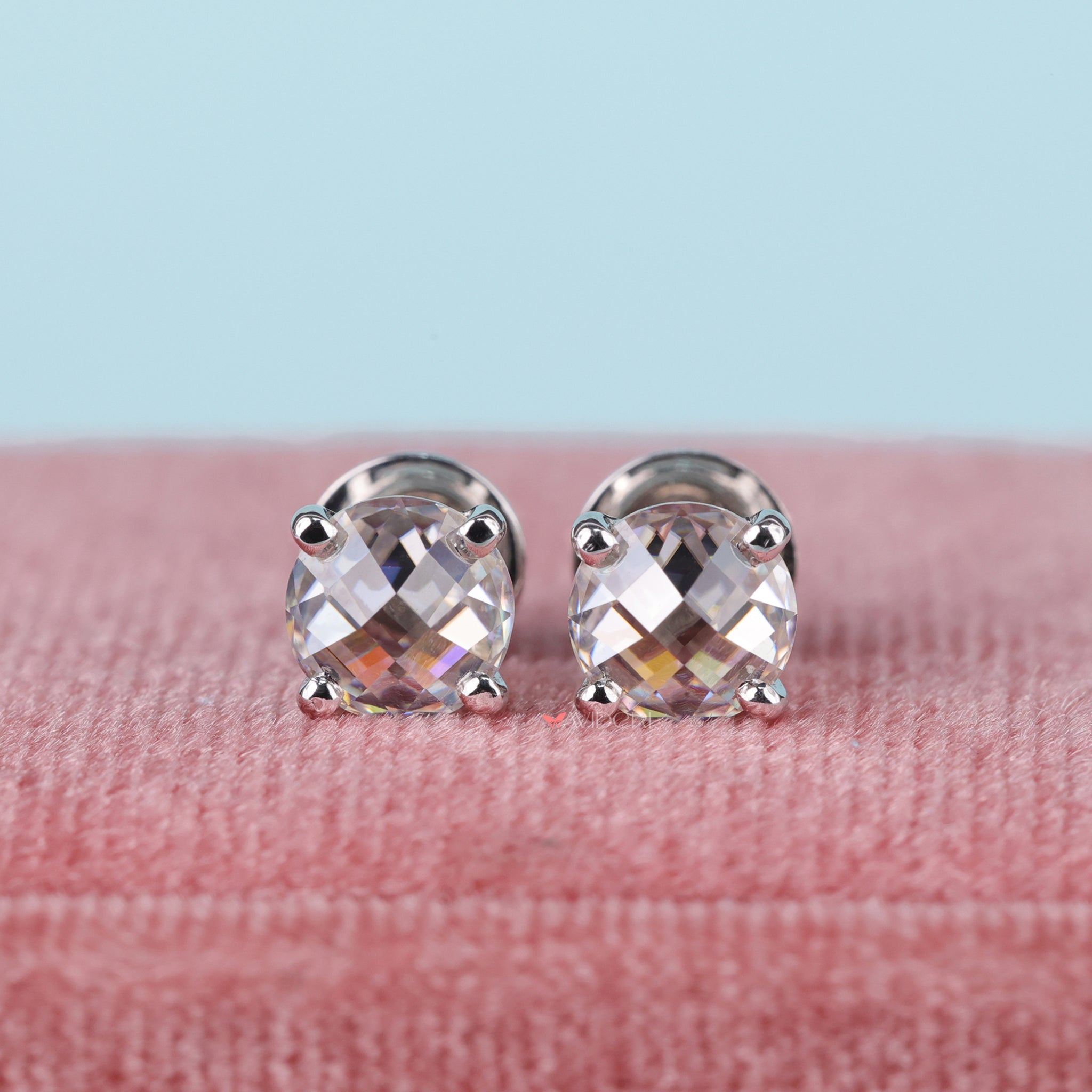 Four prong earrings securely hold the gemstone in place.