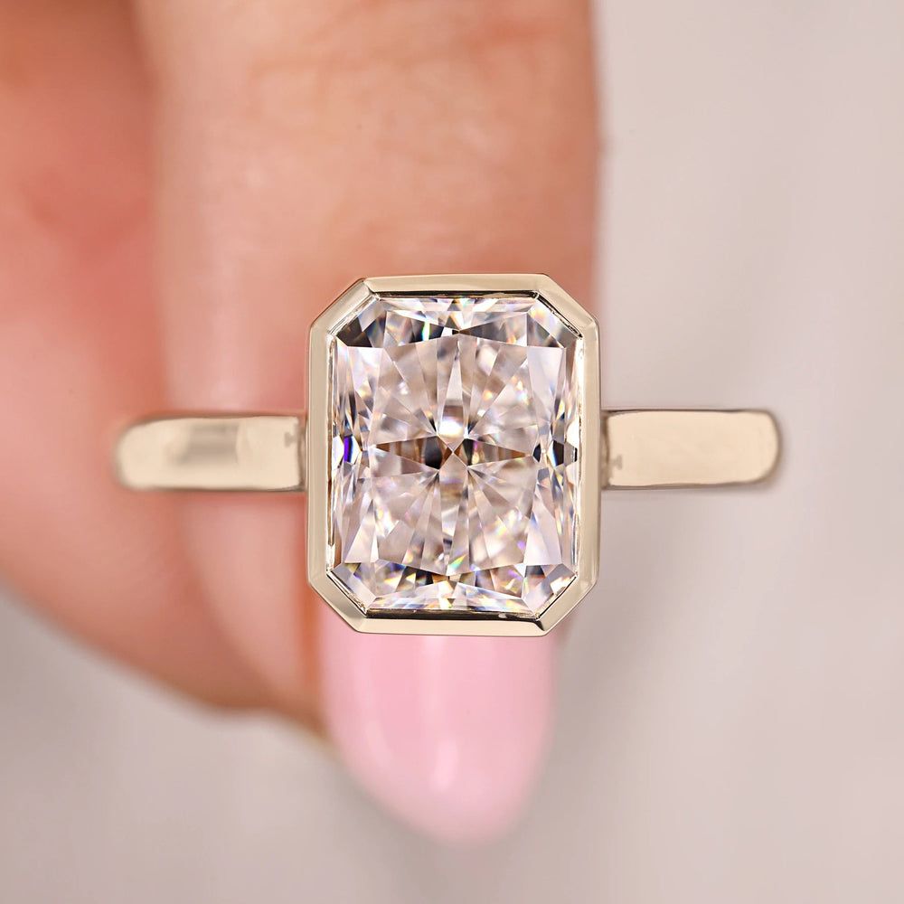 Radiant cut engagement ring shines with bright square shape.
