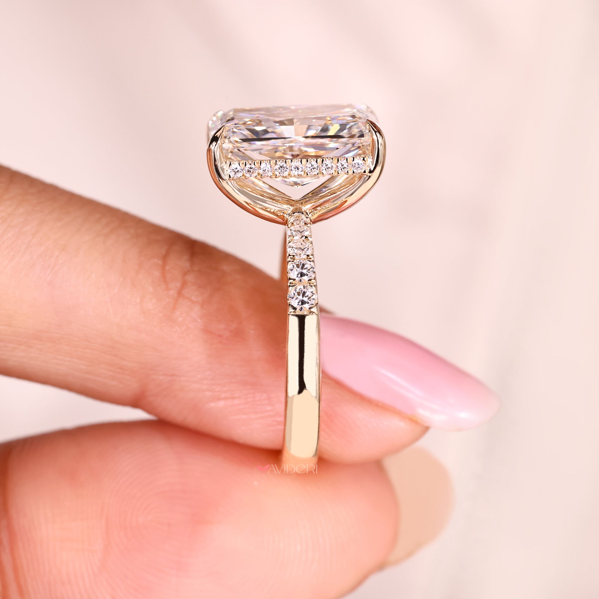 Lab grown radiant cut hidden halo engagement ring.
