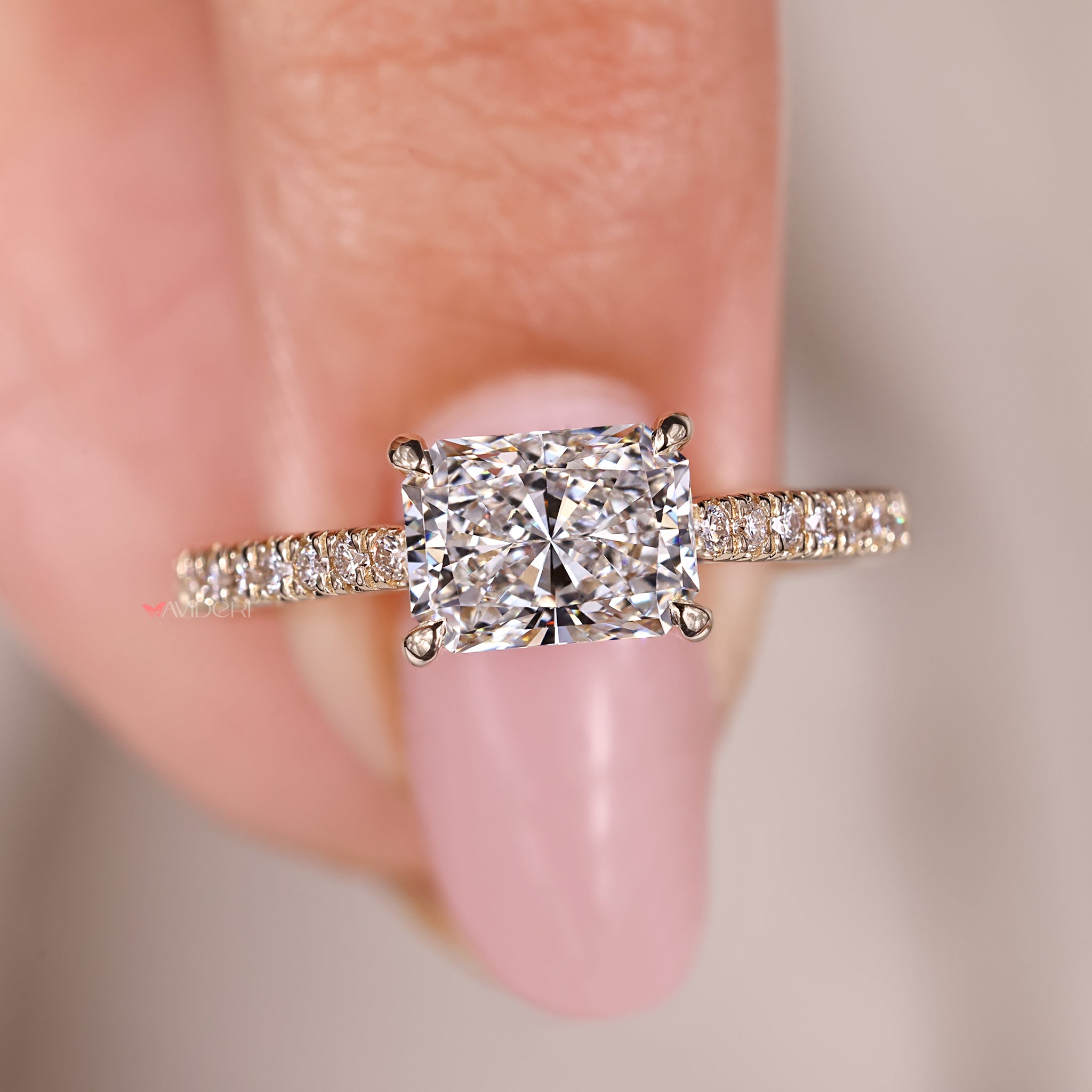 Handmade jewelry with radiant cut diamond and pave setting.