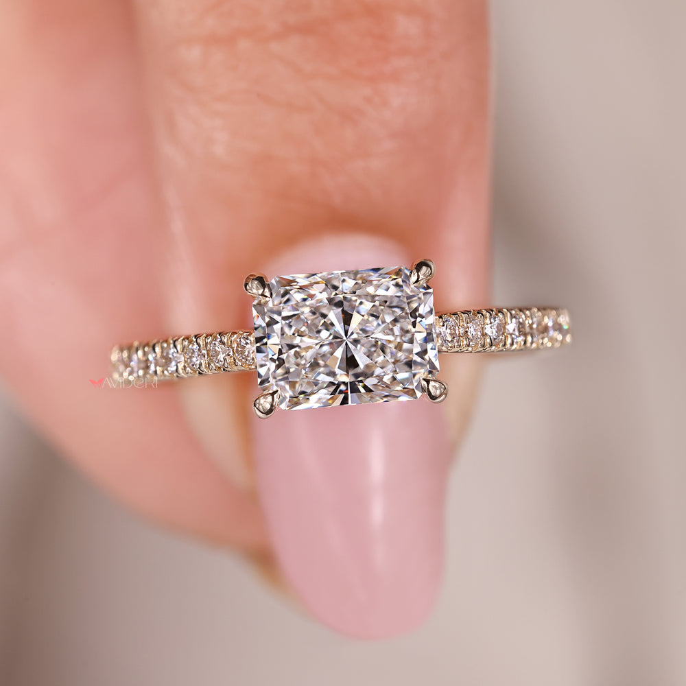 Handmade jewelry with radiant cut diamond and pave setting.