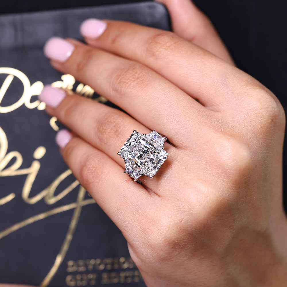 Diamond ring on a hand with a dark background