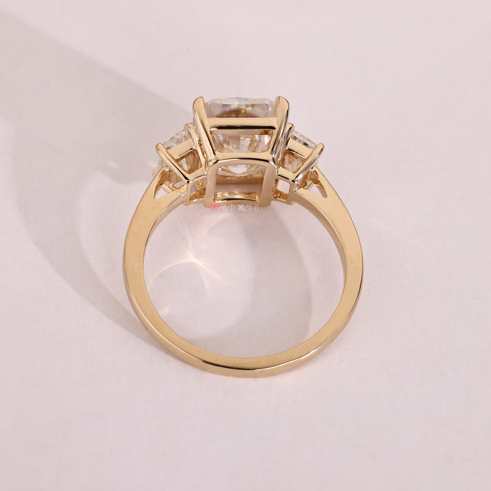 Handmade radiant cut moissanite three stone ring.
