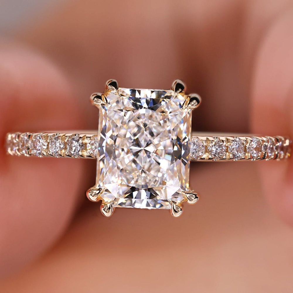 Radiant cut engagement ring with hidden halo setting ring.