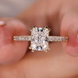Radiant cut engagement ring with hidden halo setting ring.