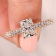 Radiant diamond engagement ring with claw prong setting.