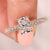 Radiant diamond engagement ring with claw prong setting.