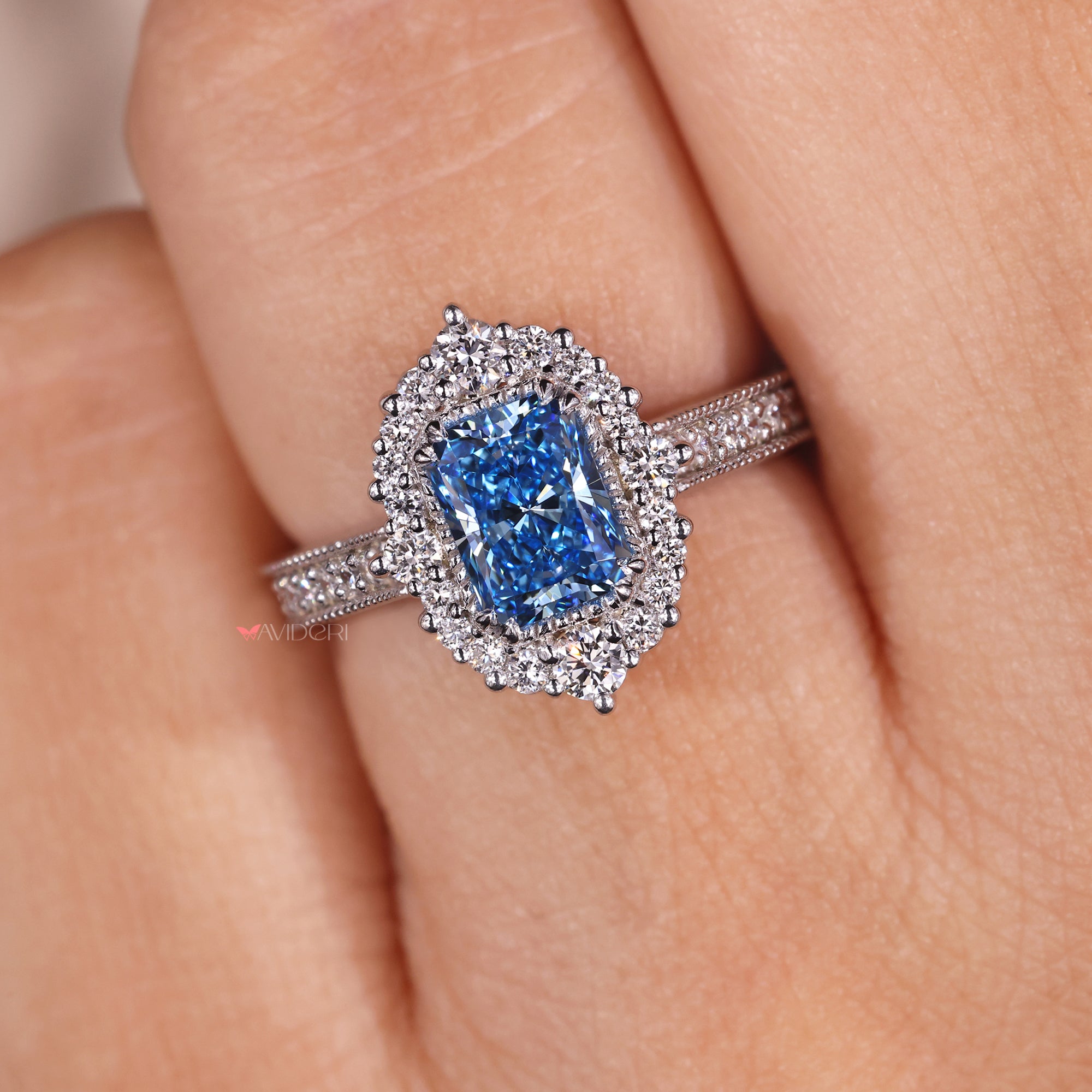 Cluster halo engagement ring with cathedral setting.