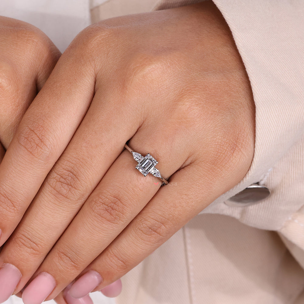 Three diamond engagement ring crafted with emerald cut emerald ring details, perfect for celebrating special moments.
