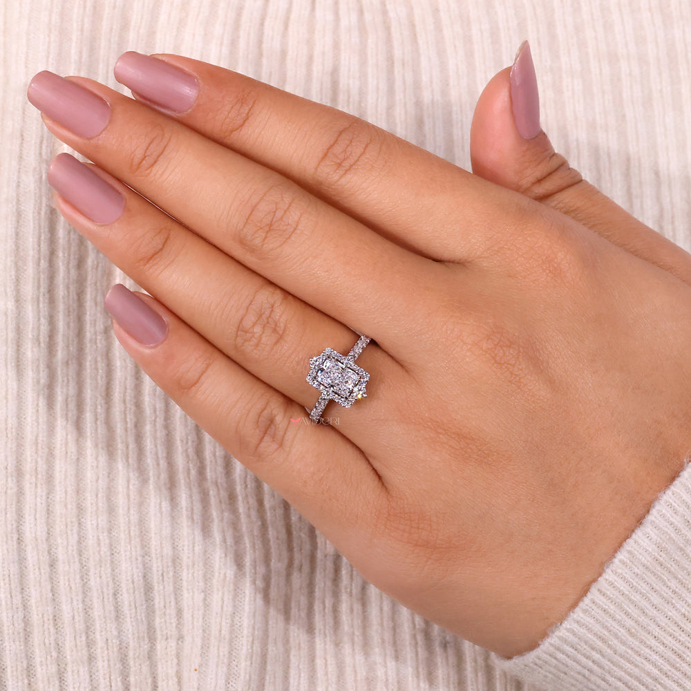 Handmade ring with a radiant cut engagement ring in white gold.
