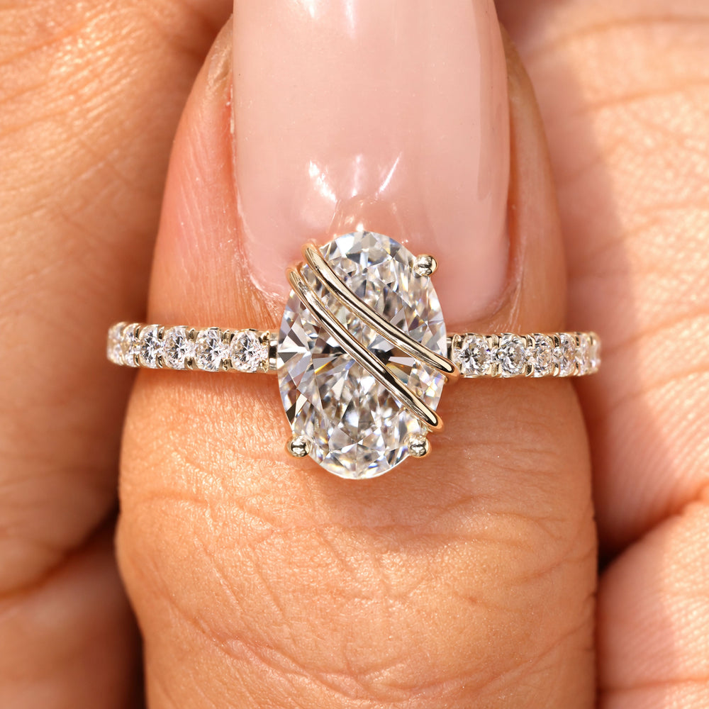 Oval engagement ring with three prong setting.
