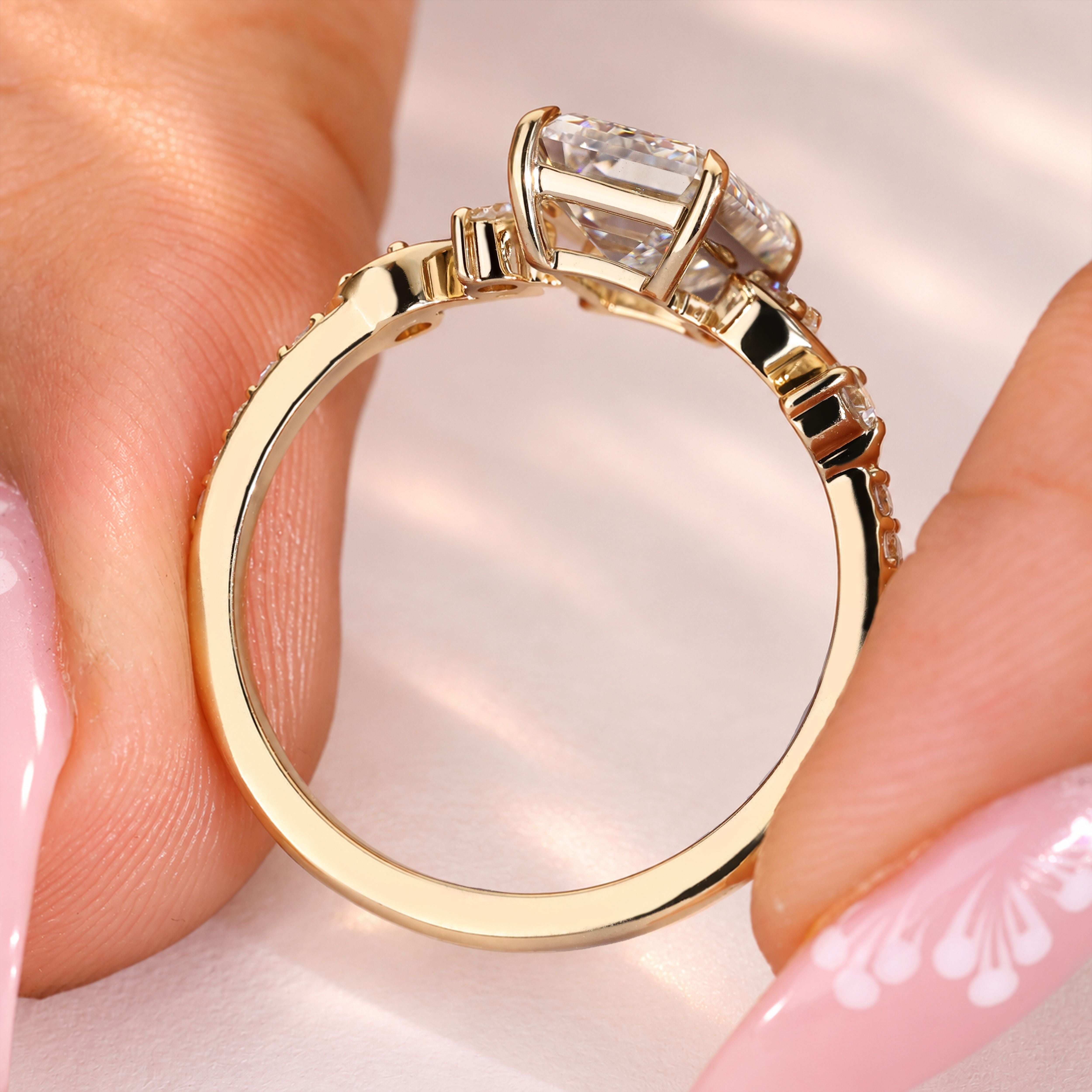 Marquise engagement ring with sculpted floral sides.
