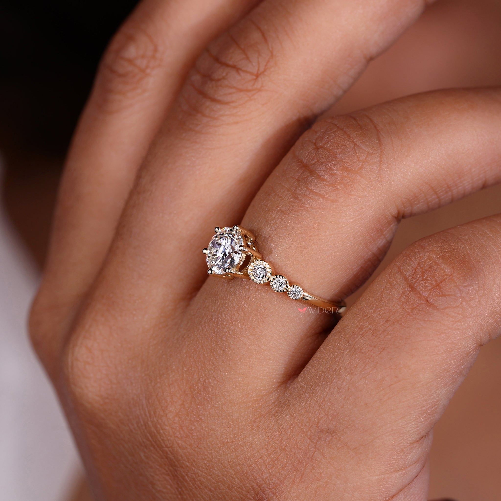 Milgrain engagement ring with seven stone diamond ring elements crafted with precision and elegance.
