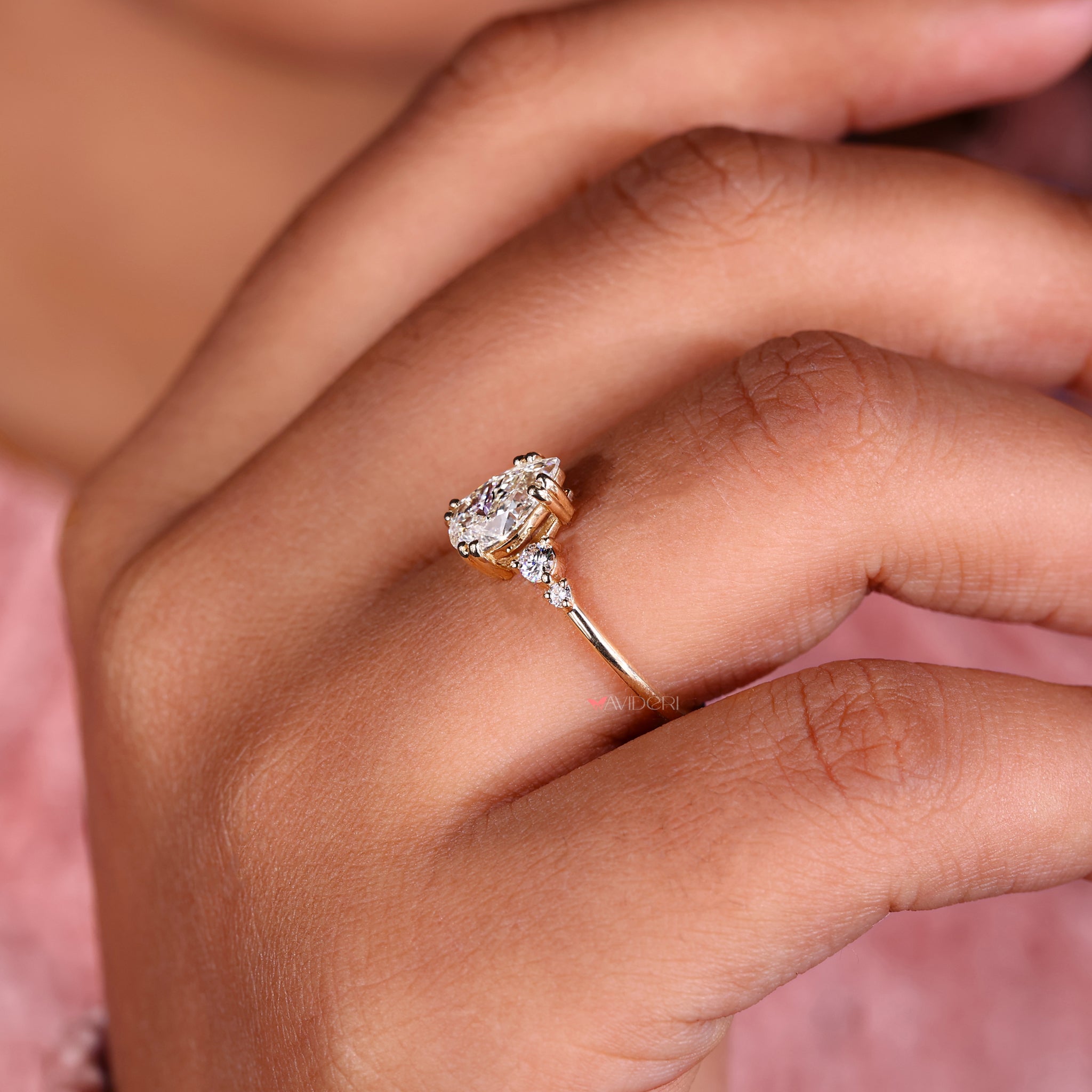 Tear drop ring featuring a pear shaped diamond ring and a double prong engagement ring setting for durability.
