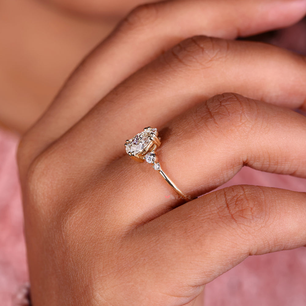 Tear drop ring featuring a pear shaped diamond ring and a double prong engagement ring setting for durability.
