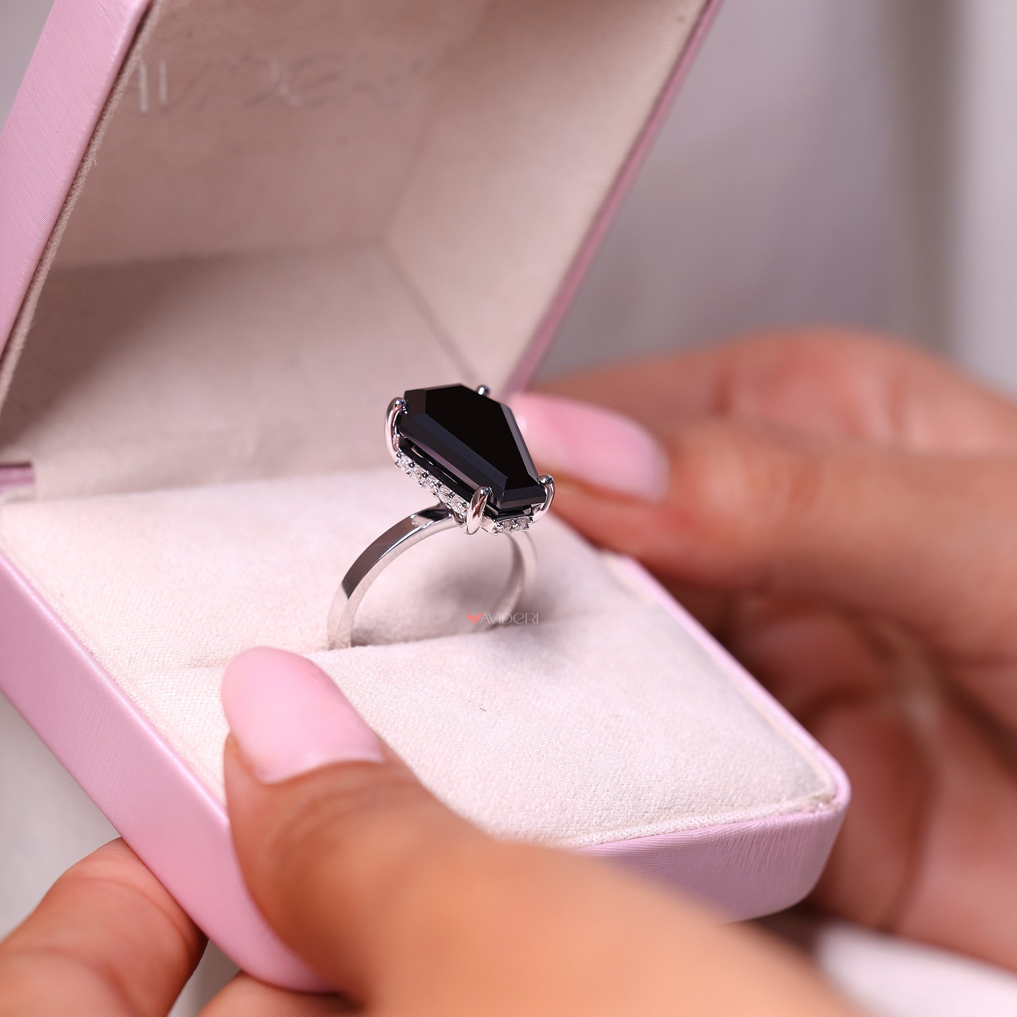 Round hidden halo setting adds sparkle around the center.