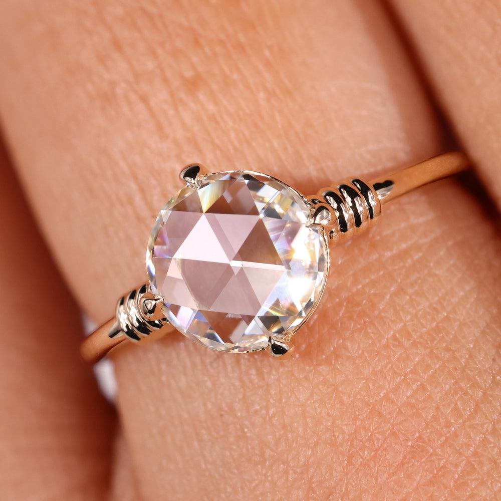 Rose cut diamond ring featuring a stunning round diamond engagement ring design.
