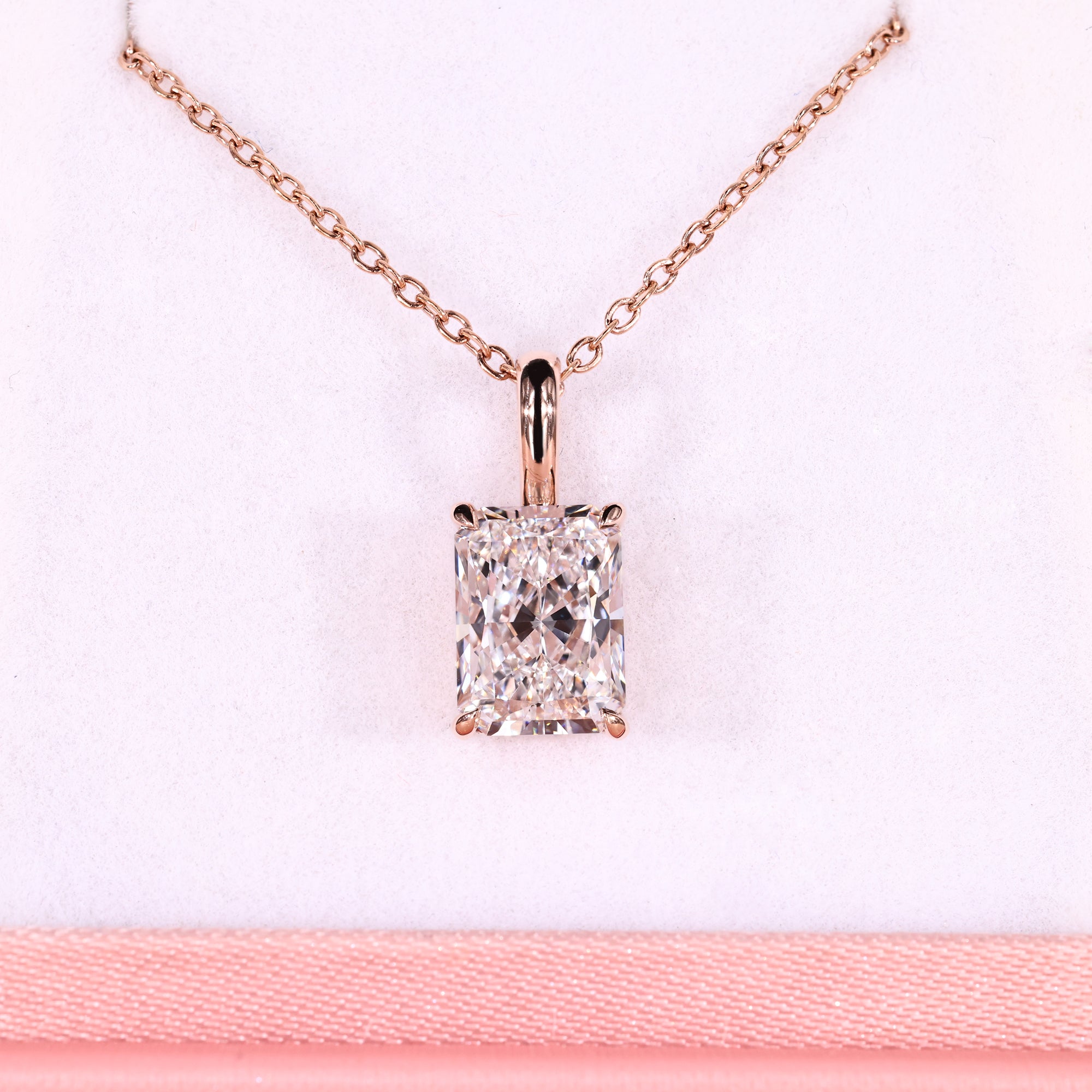 Rose gold pendant with radiant diamond pendant.