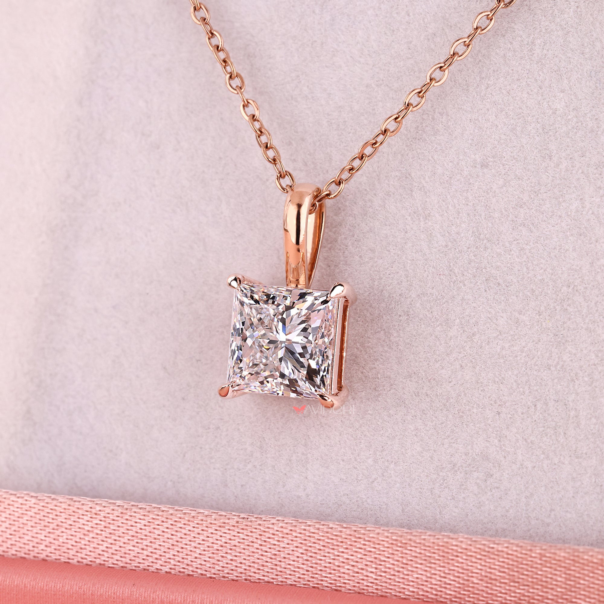 Diamond pendant in 4 claw prong setting.