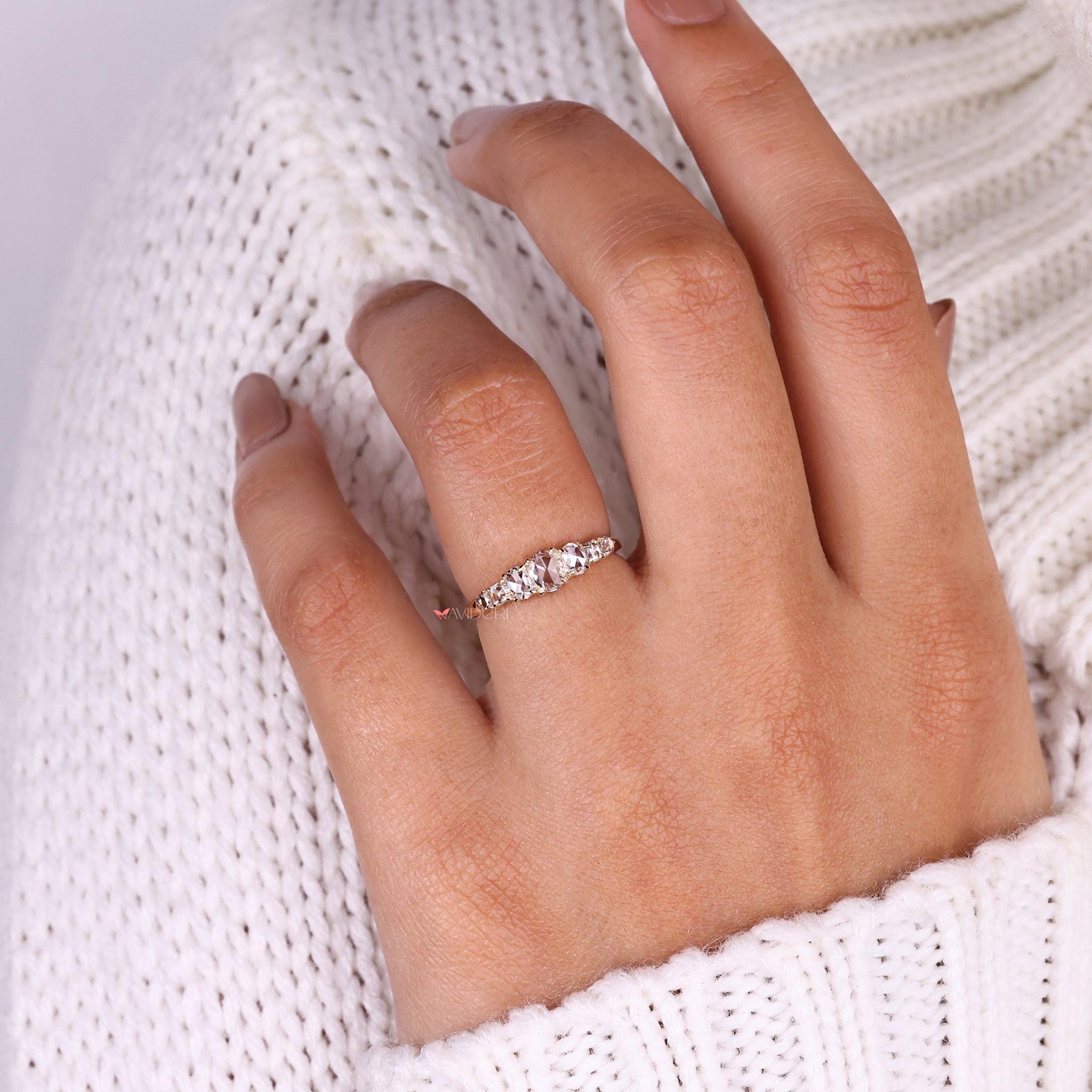 Oval rose cut diamond ring with a unique design.
