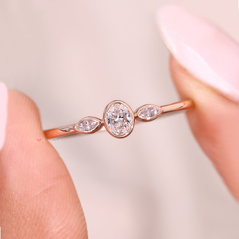 Lab grown oval diamond ring with marquise accent stones.
