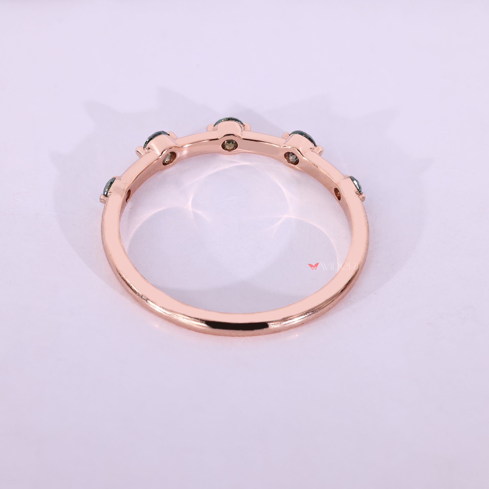 Half eternity band provides a minimalist style with subtle sparkle on one side.